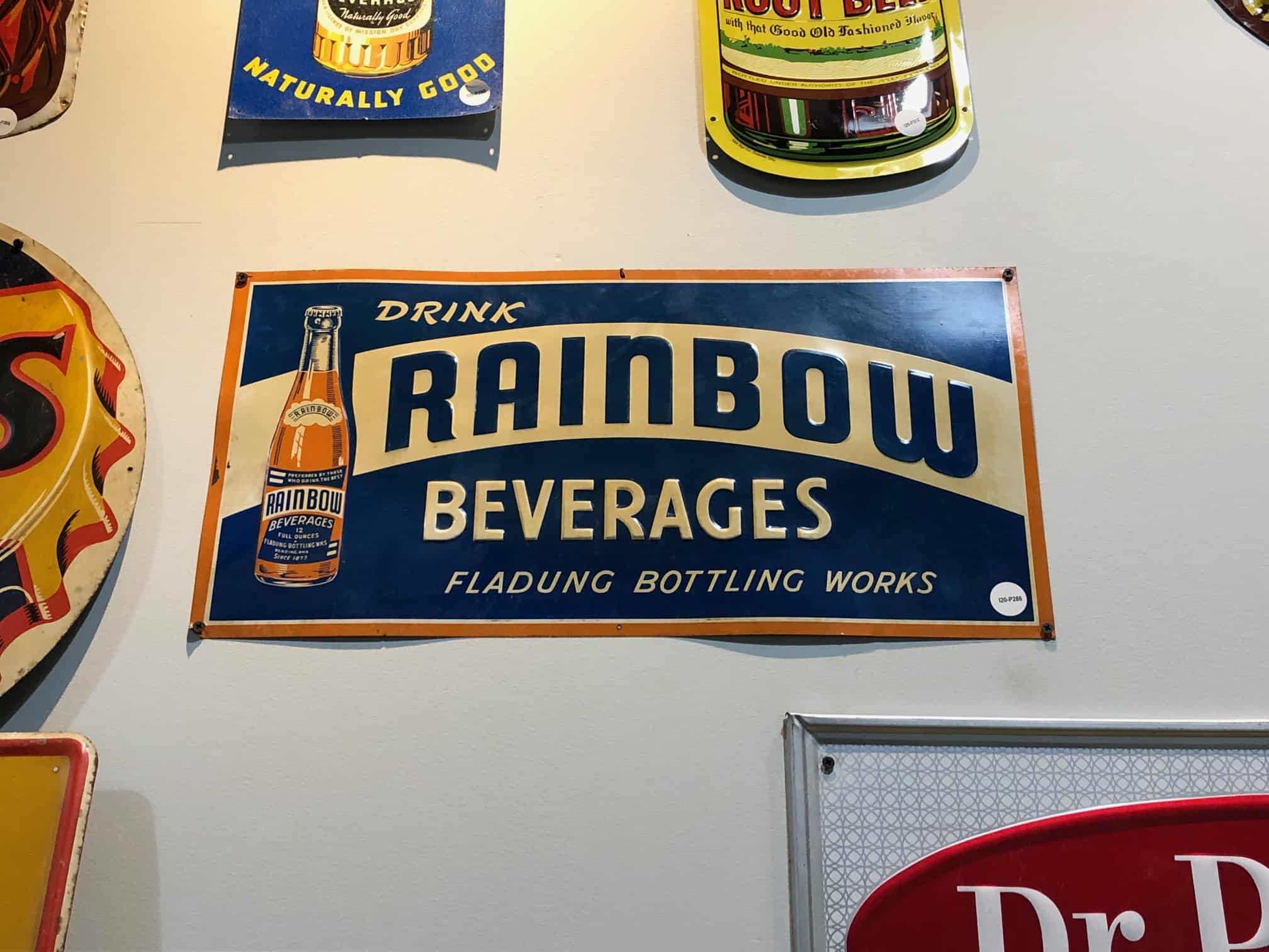 Rainbow Beverages Tin Sign