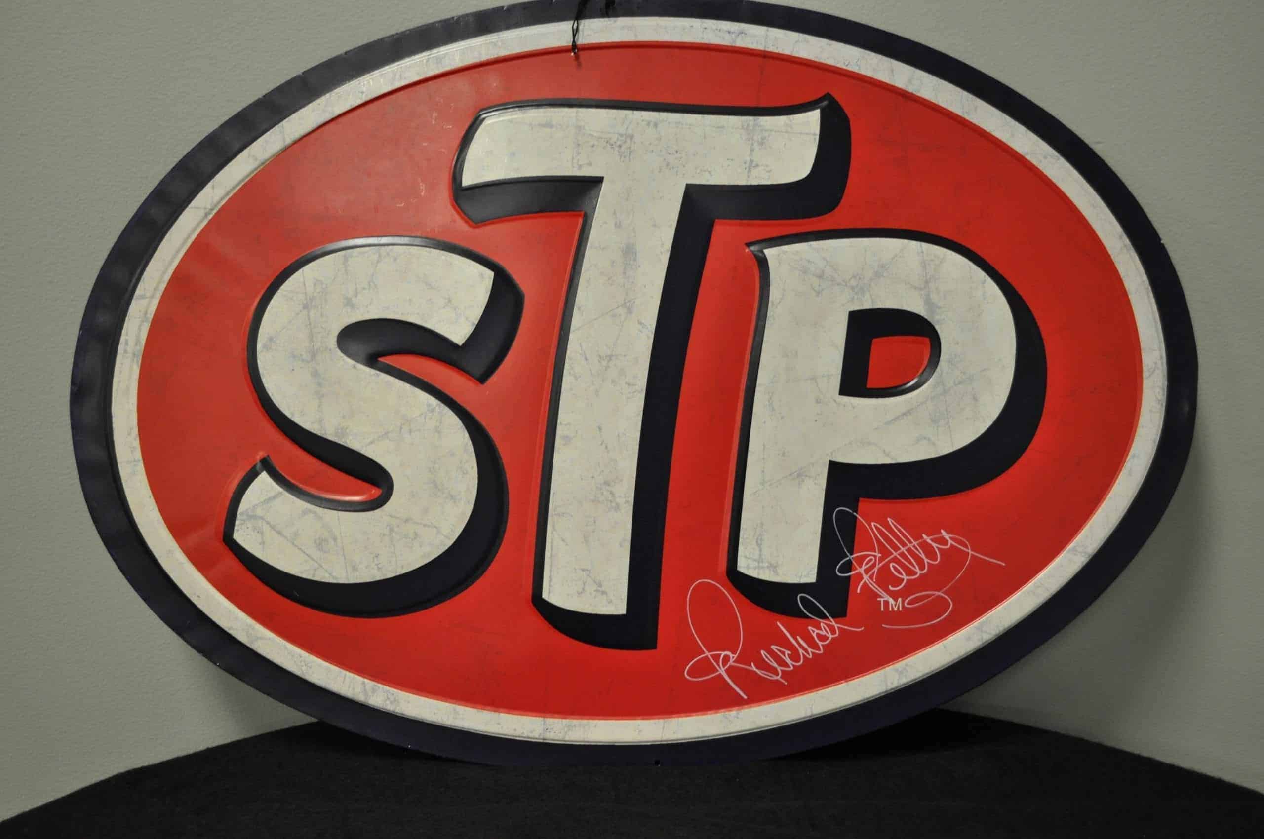 Richard Petty Autographed Stp Tin Shop Sign